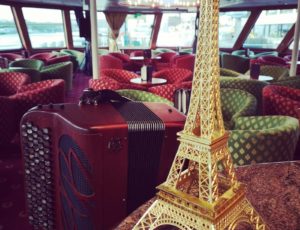 accordion from Paris with eiffel tower during a cruise