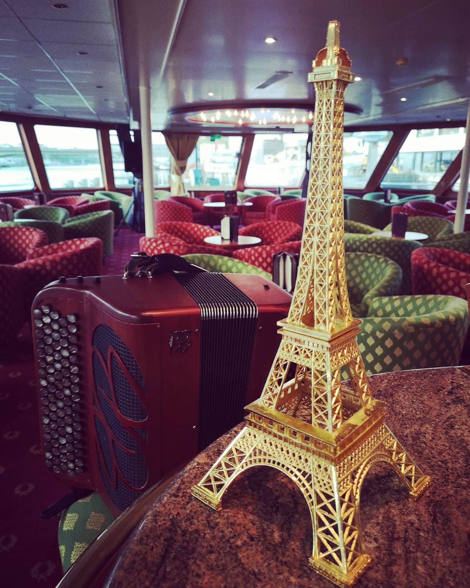 accordion from Paris with eiffel tower during a cruise