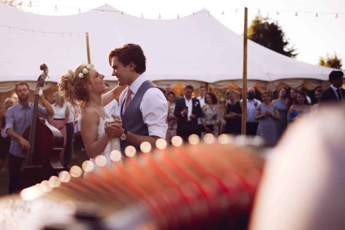 A french accordionist makes the bride and groom dance during the wedding celebration